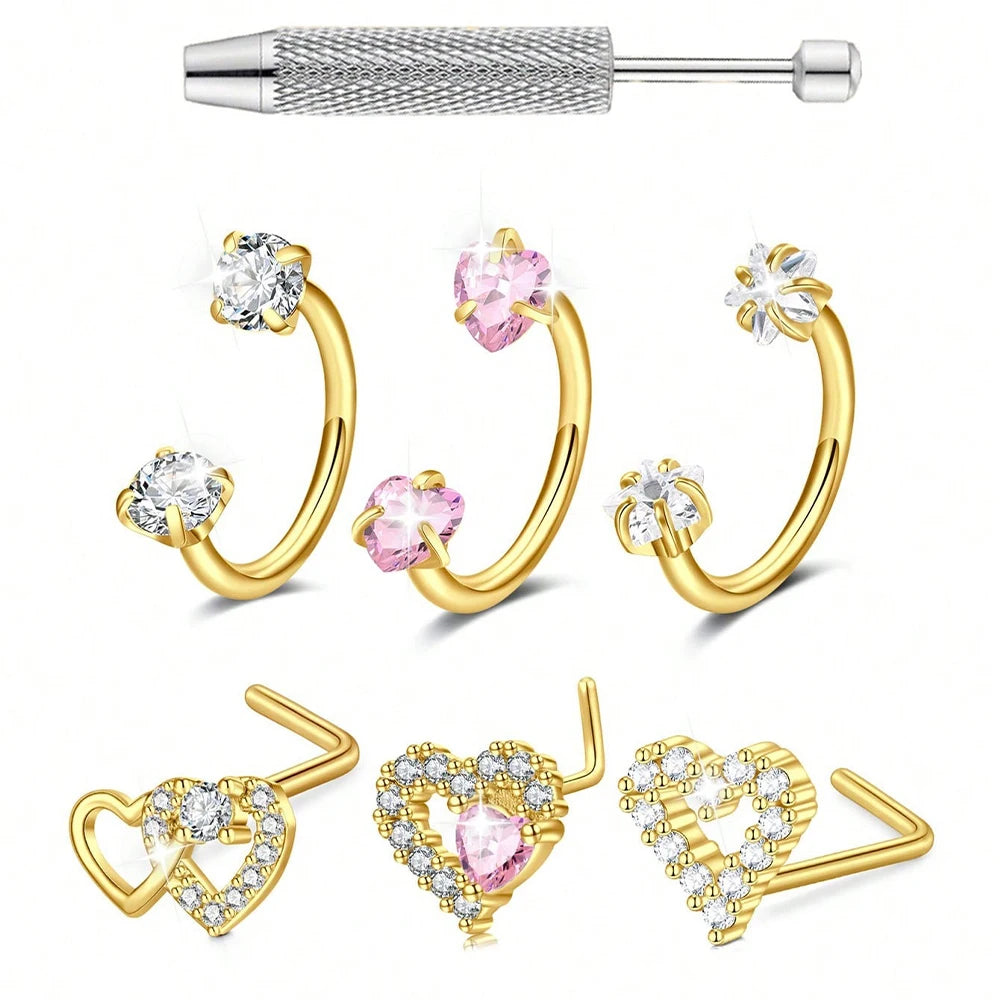 Three pieces of stainless steel heart horseshoe nose studs featuring clear and pink gemstones.