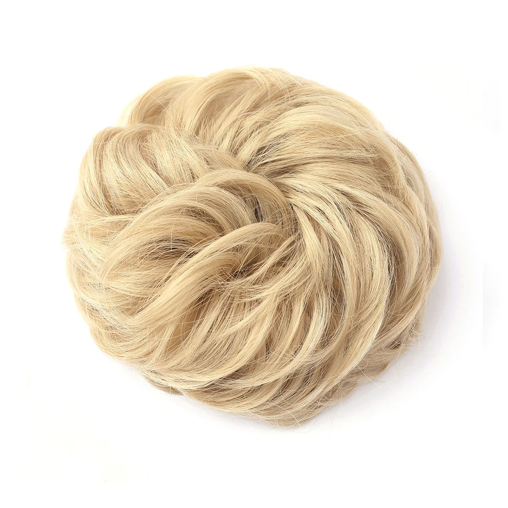 A light blonde, textured hair piece styled into a large messy bun for updos.