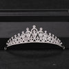 A sparkling crystal rhinestone bridal tiara headpiece displayed on a dark surface.