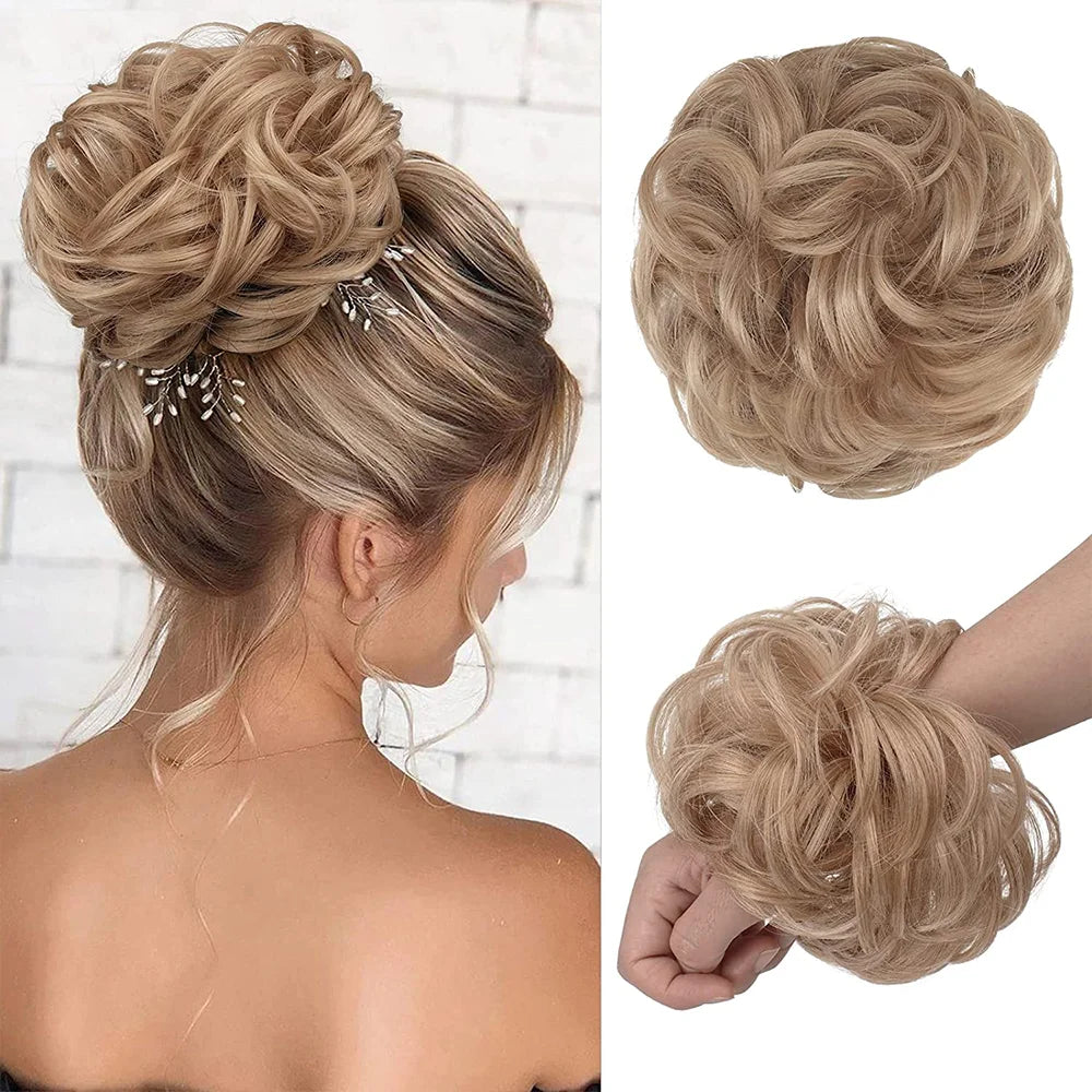 A woman shows off a blonde messy bun hairstyle with decorative hair pieces and scrunchies.