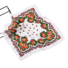 White square scarf with an intricate floral print featuring red, orange, and green flowers and leaves.