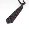 A dark blue and red plaid necktie folded and displayed against a white background.