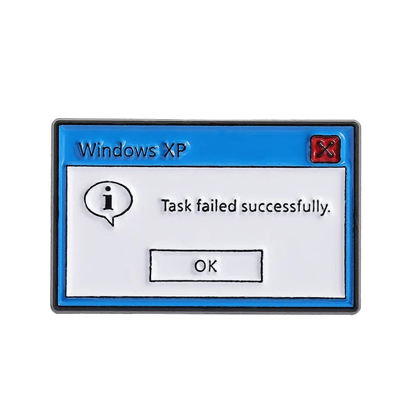 A lapel pin featuring a blue Windows XP error message dialog box with the text Task failed successfully and an OK button.