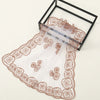 A sheer, floral embroidered lace bandana headscarf displayed in a black frame.