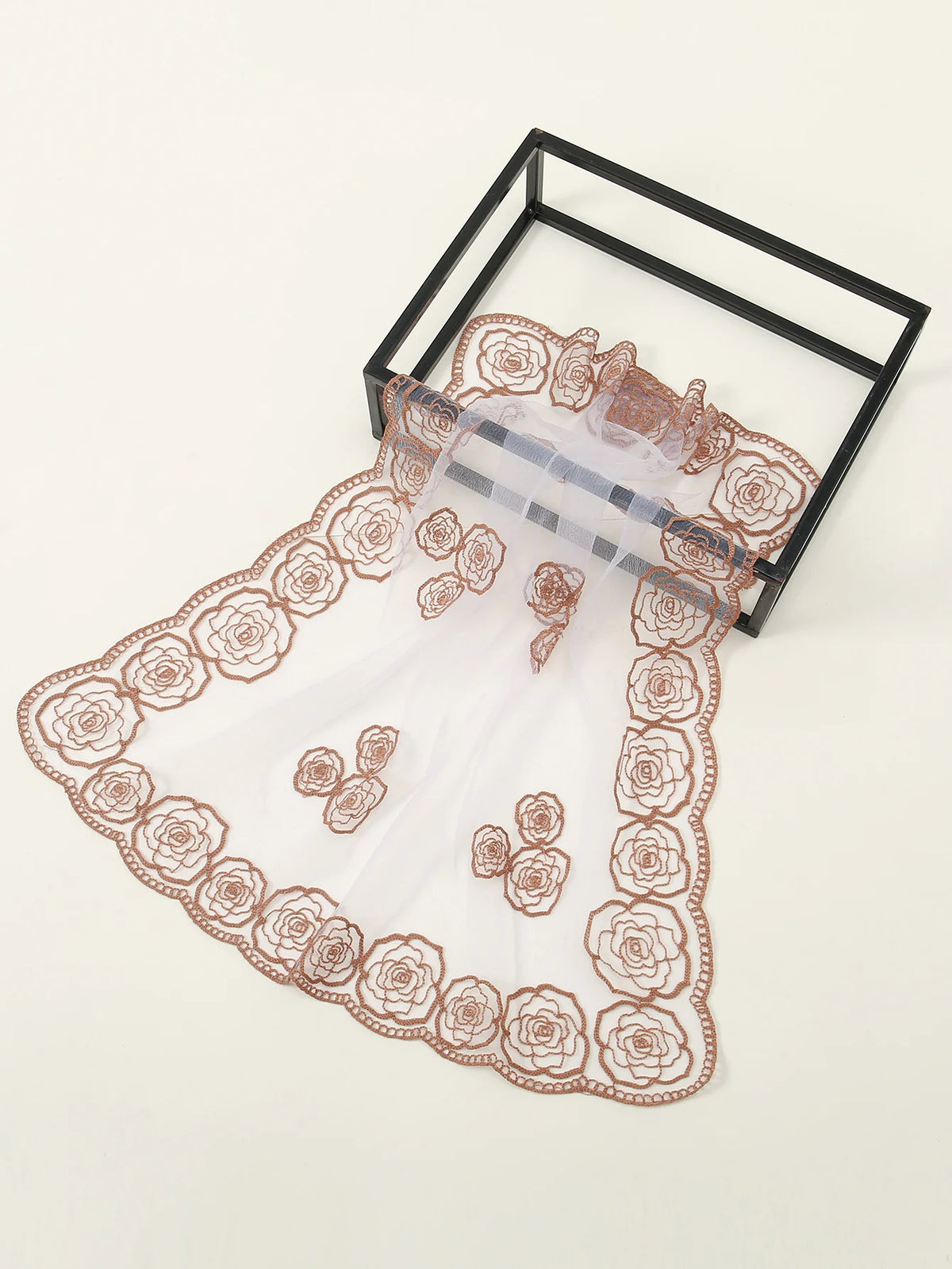 A sheer, floral embroidered lace bandana headscarf displayed in a black frame.