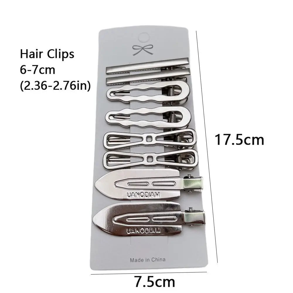 A set of vintage silver Y2K metal hair clips with various sizes displayed on a white background.