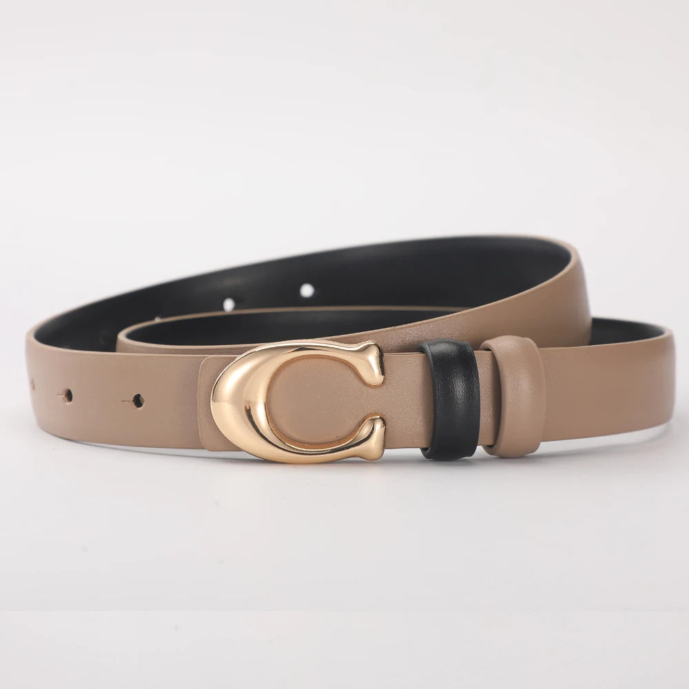 A women's smooth double-sided belt in beige leather with a gold C-shaped buckle and black accents.