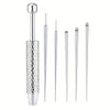 A set of titanium piercing tools including various needles and tips for nose, lip, and cartilage piercings.