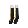 Pair of black socks with a white and gold chicken print design.