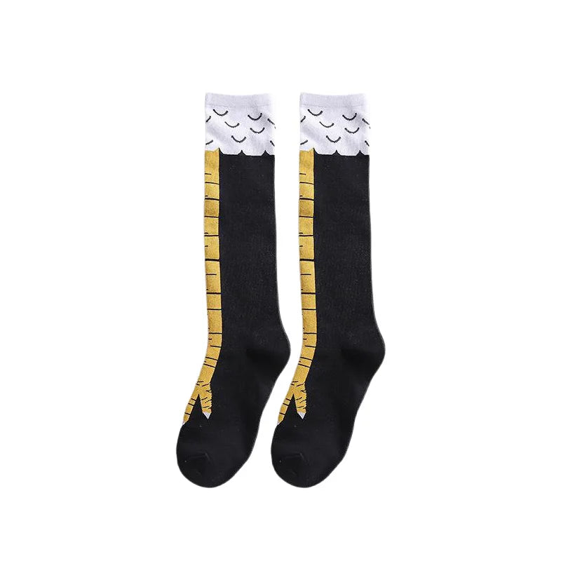 Pair of black socks with a white and gold chicken print design.