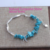 Sterling silver double heart charm bracelet featuring natural turquoise stone beads