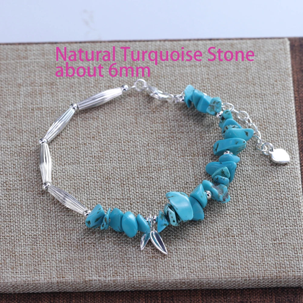 Sterling silver double heart charm bracelet featuring natural turquoise stone beads