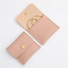 A light pink PU leather jewelry pouch with a snap button closure, shown in a diagonal layout.