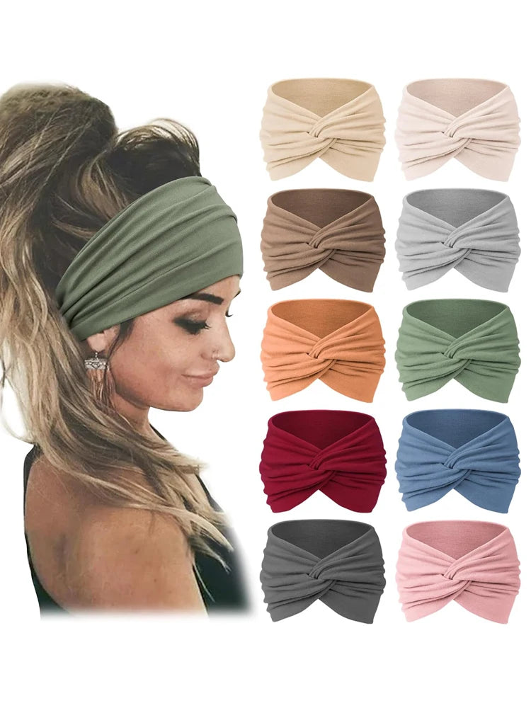 A collection of eight folded fabric headbands in various earthy and muted colors like olive green, beige, terracotta, and gra