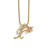 A gold-toned alphabet flower pendant necklace featuring an initial letter and a pink gemstone.