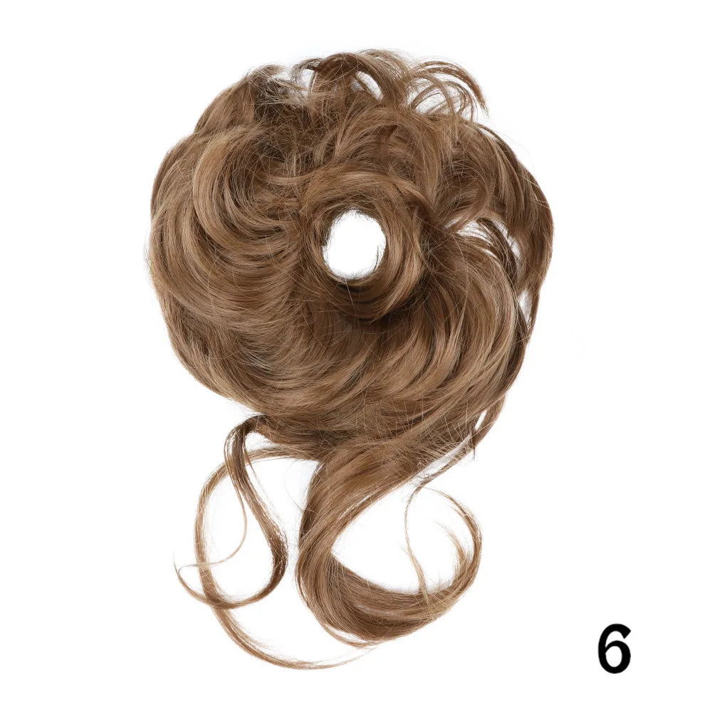 A bundle of messy brown synthetic hair styled into a bun and long flowing strands.