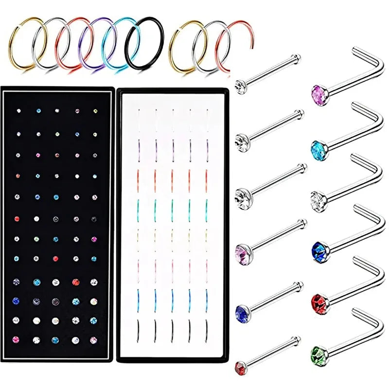 Stainless steel nose stud set for body piercing featuring various sized and colored studs.