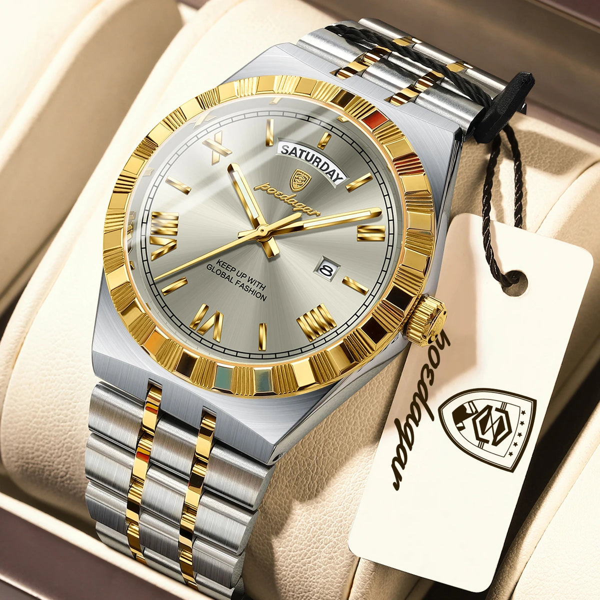 A silver and gold men's luminous quartz wristwatch with a leather strap is displayed in a light-colored box.