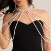 A woman models an imitation pearl statement necklace set with multiple strands draped across her décolletage.