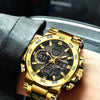 A close-up shot of a gold-toned chronograph dive watch on a black leather strap, worn on a wrist.