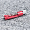 A set of three precision watch link pin remover tools with red and silver components resting on a gray textured surface.