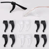 A collection of black and clear silicone anti-slip ear hooks for eyeglasses.