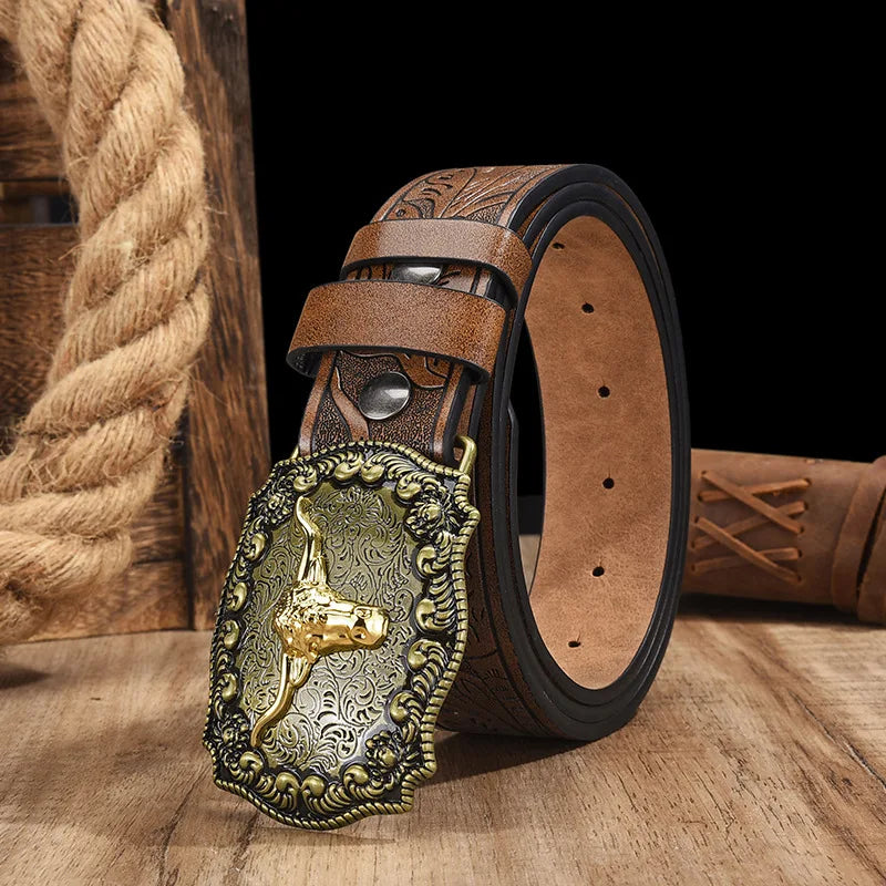 A vintage western PU leather belt with a detailed gold-toned buckle resting on a wooden surface.