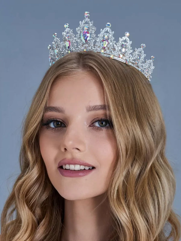 A blonde woman wearing an elegant crystal rhinestone tiara and headband set.