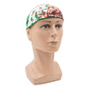 Frauenkopf mit grün-weißem Bandana, zeigt bunte Darstellung eines Löwen und Laubwerks.