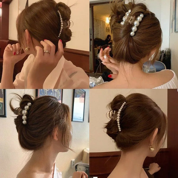 A woman's hair is styled in an elegant updo with simulated pearl hair claws.