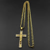 A gold-tone stainless steel cross pendant necklace with rhinestone accents hanging from a chain.