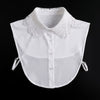 White blouse with a lace false collar and detachable neckline, shown against a black background.