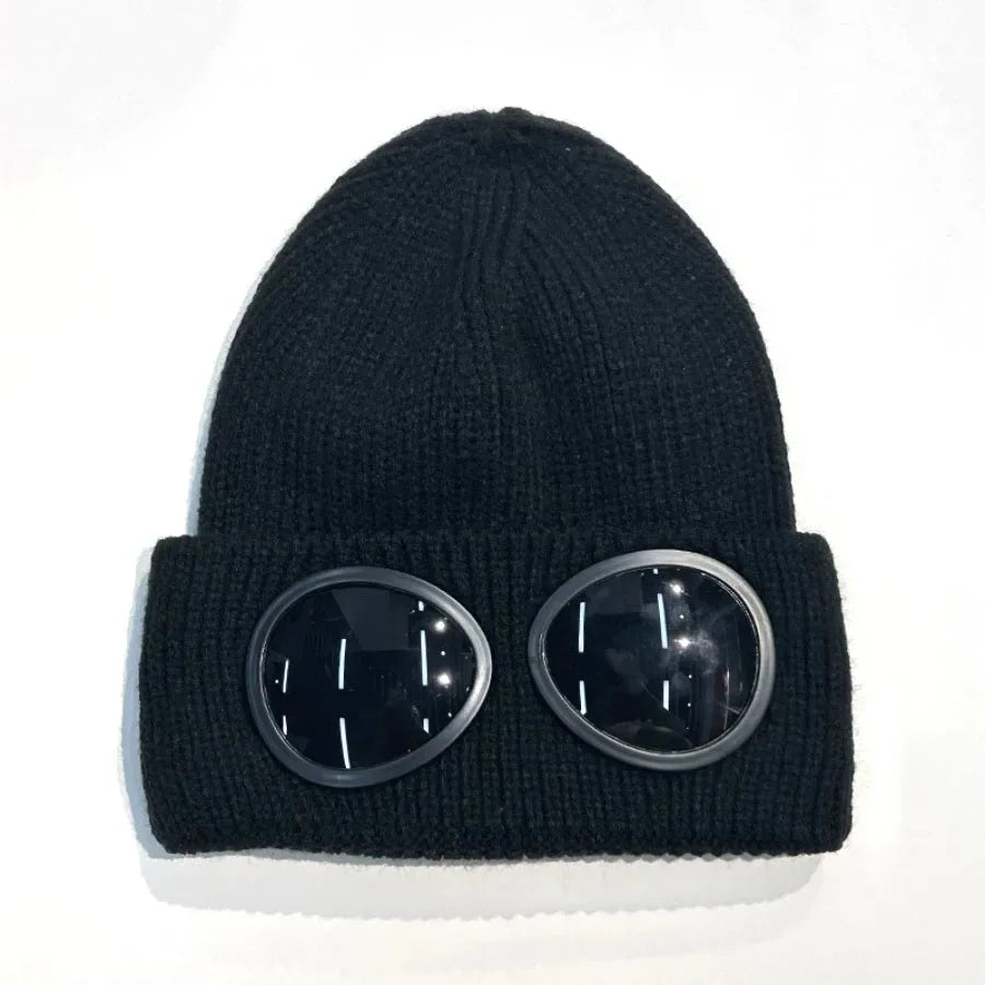 Black knit windproof hat with round, dark tinted goggles