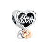 Silver heart charm with M&M engraving and a separate thank you heart.