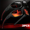 A pair of black sporty polycarbonate sunglasses with red accents, shown against a dark background.
