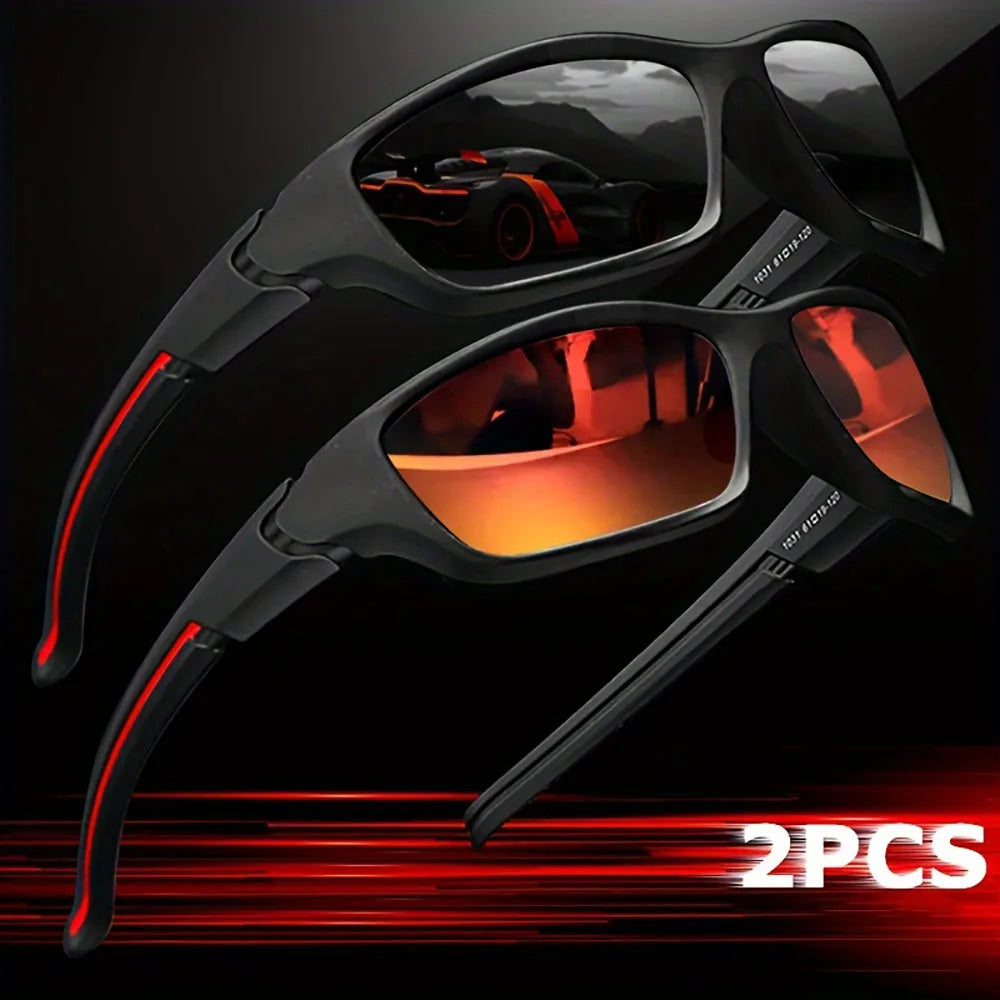 A pair of black sporty polycarbonate sunglasses with red accents, shown against a dark background.