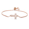 Adjustable gold plated cross bracelet with cubic zirconia set on a delicate chain.