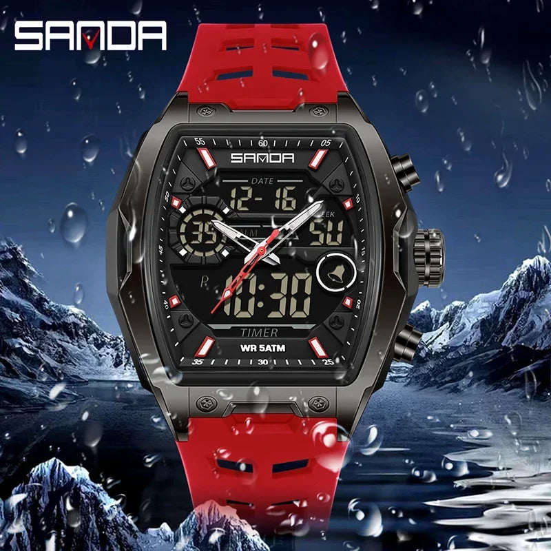 Rote und schwarze SANDA Herren-Chronographen-Armbanduhr vor schneebekichtetem Berg-Hintergrund.