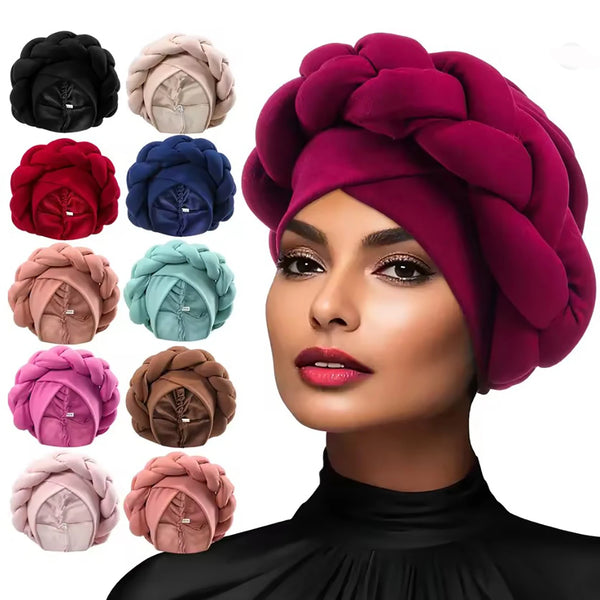 A model wears a deep magenta braided turban cap with various shades of pink and purple headwear options.