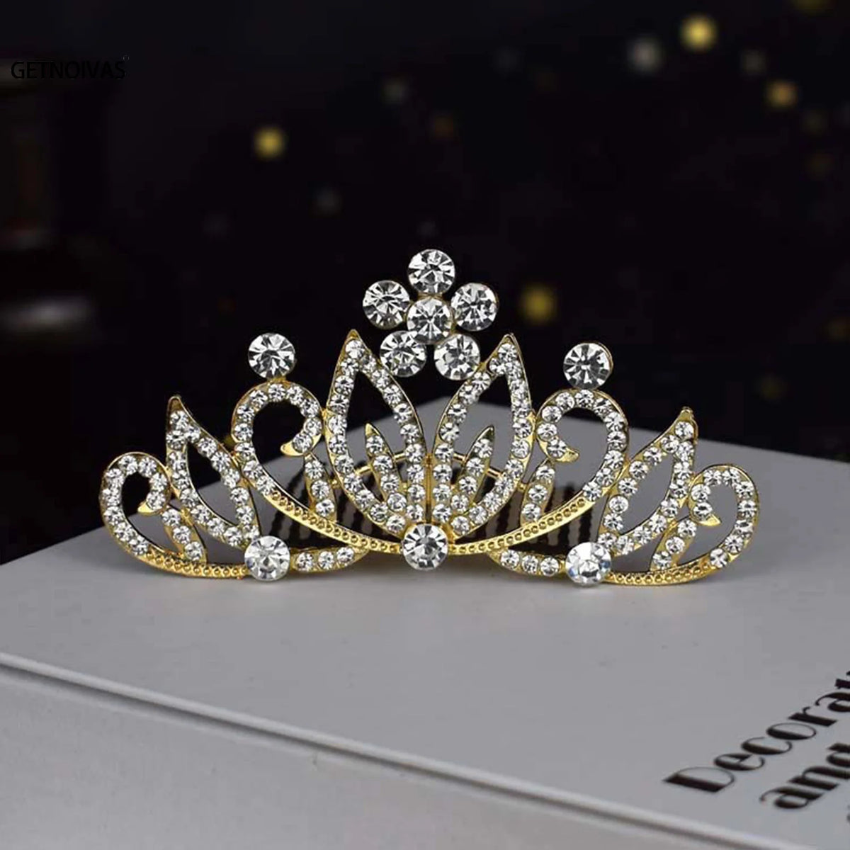 Gold crystal princess tiara hair comb for women displayed on a white box.
