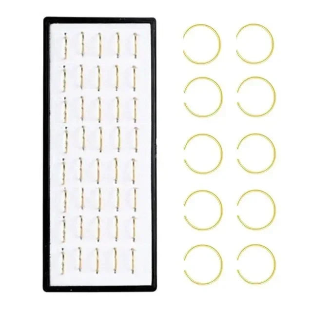 A set of fashion crystal stainless steel nose stud piercing jewelry including various hoop and stud designs.