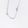 A delicate silver extension chain necklace with small jump rings for jewelry making.