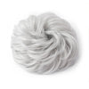 A ball of light gray, wispy hair used as a messy bun hair piece for curly updos.
