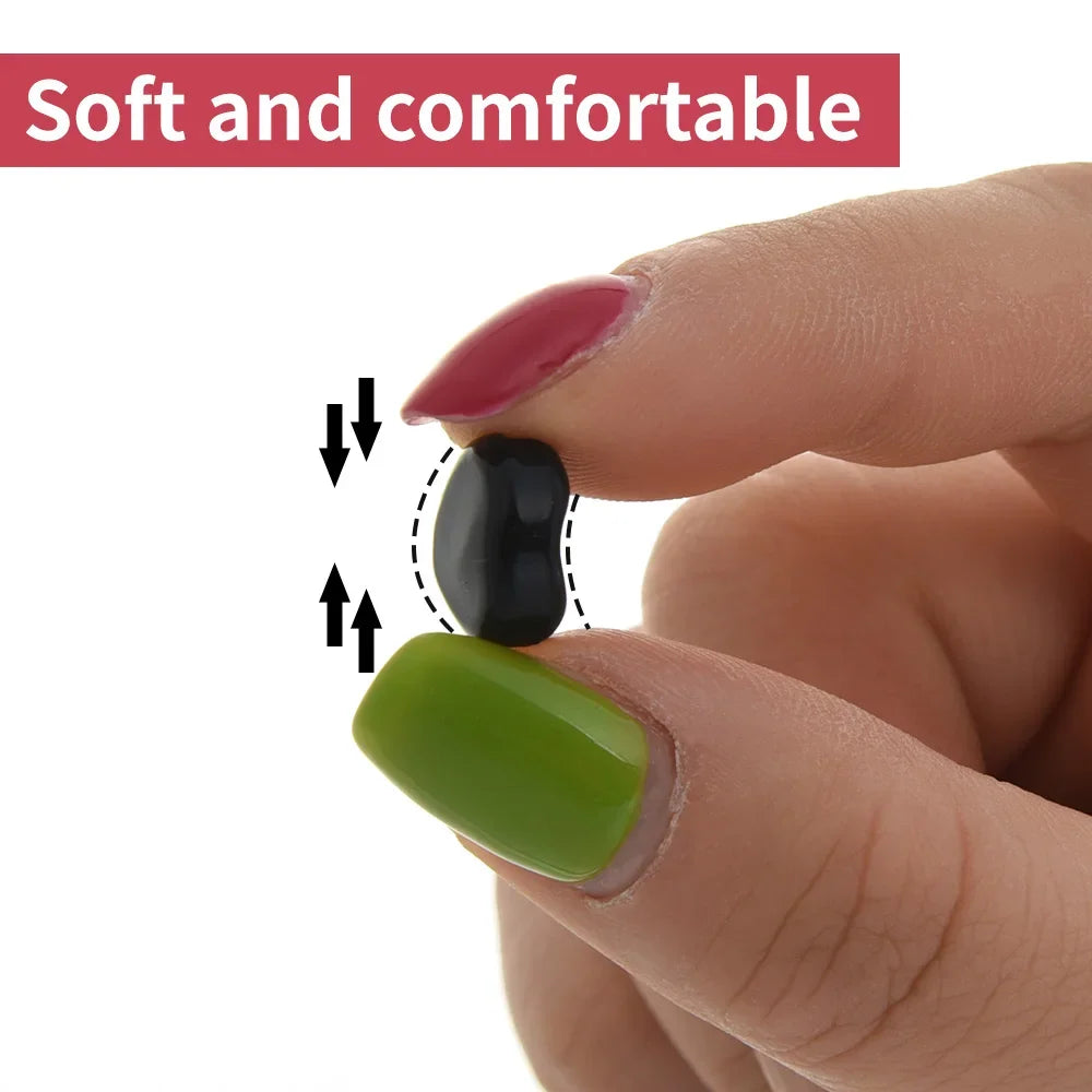 A hand is holding a pair of silicone ear hooks, showing different colors and sizes for glasses.