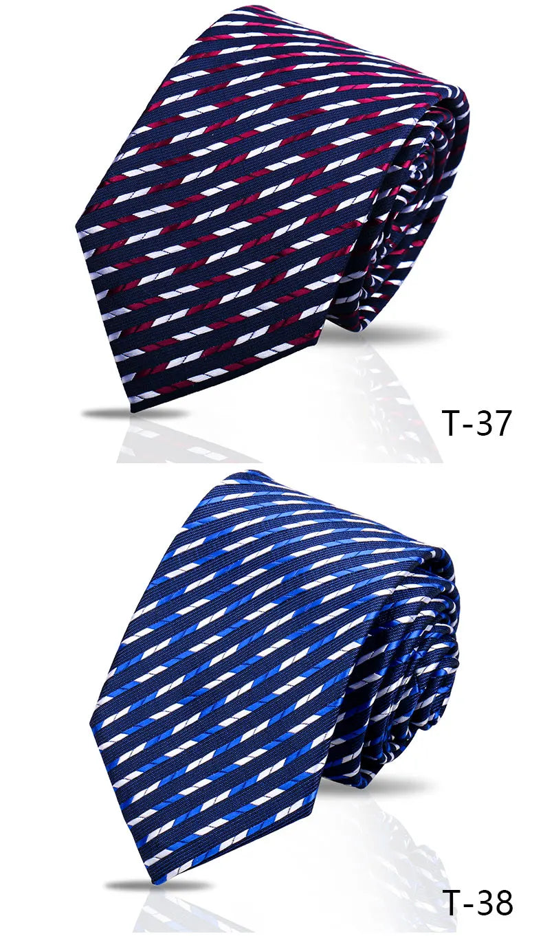 A close-up of a navy blue striped necktie with red accents, shown folded.