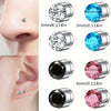 Close-up view of magnetic nose stud earrings in silver and pink tones, showing different facets and sizes.