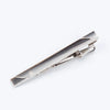 Silver metal tie clip for men's neckties with a decorative design.