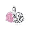 A silver family tree charm necklace featuring a heart pendant and a small ball charm.