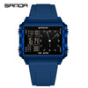 A blue digital wristwatch with a black face and luminous display on a dark background.