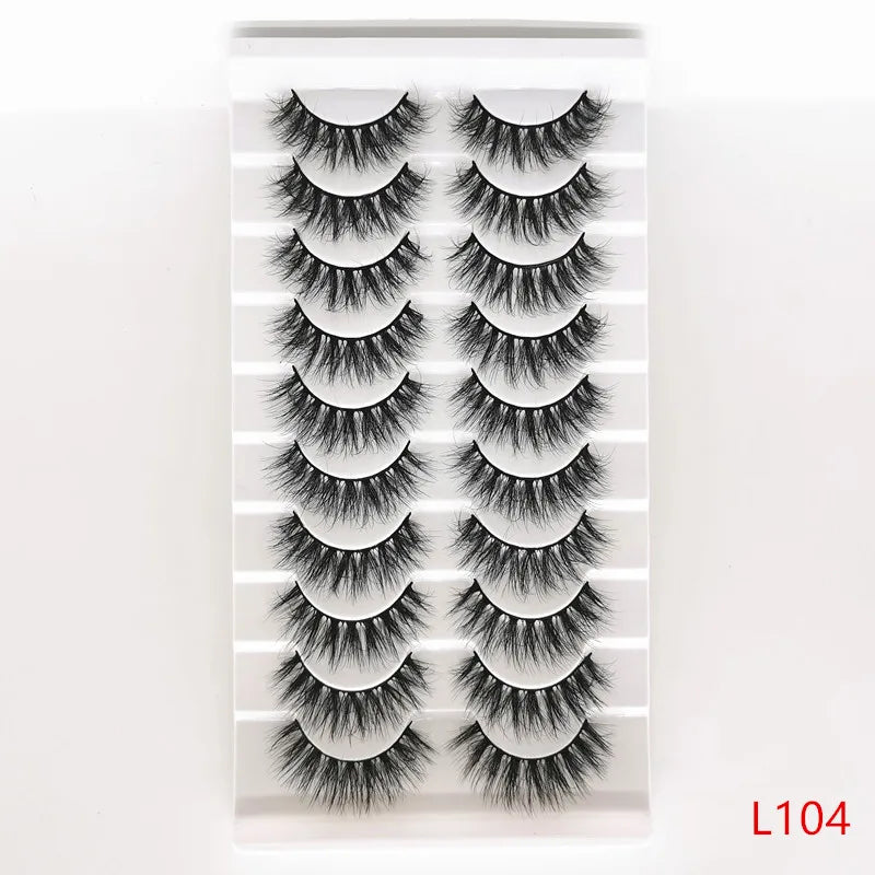 A strip of dramatic mink false eyelashes displayed on a clear plastic card.